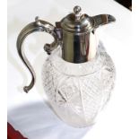A silver mounted cut glass claret jug, by Barker Bros. Birmingham, hinged lid, scroll handle
