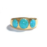 A turquoise ring, the graduated round cabochon turquoise inset in a yellow plain polished shank,