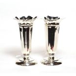 A pair of Edward VII silver vases, by Deakin and Francis, Birmingham, 1909, each fluted tapering and