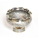 A late 19th century Indian or Burmese silver rose-bowl, stamped '90', the sides chased with building