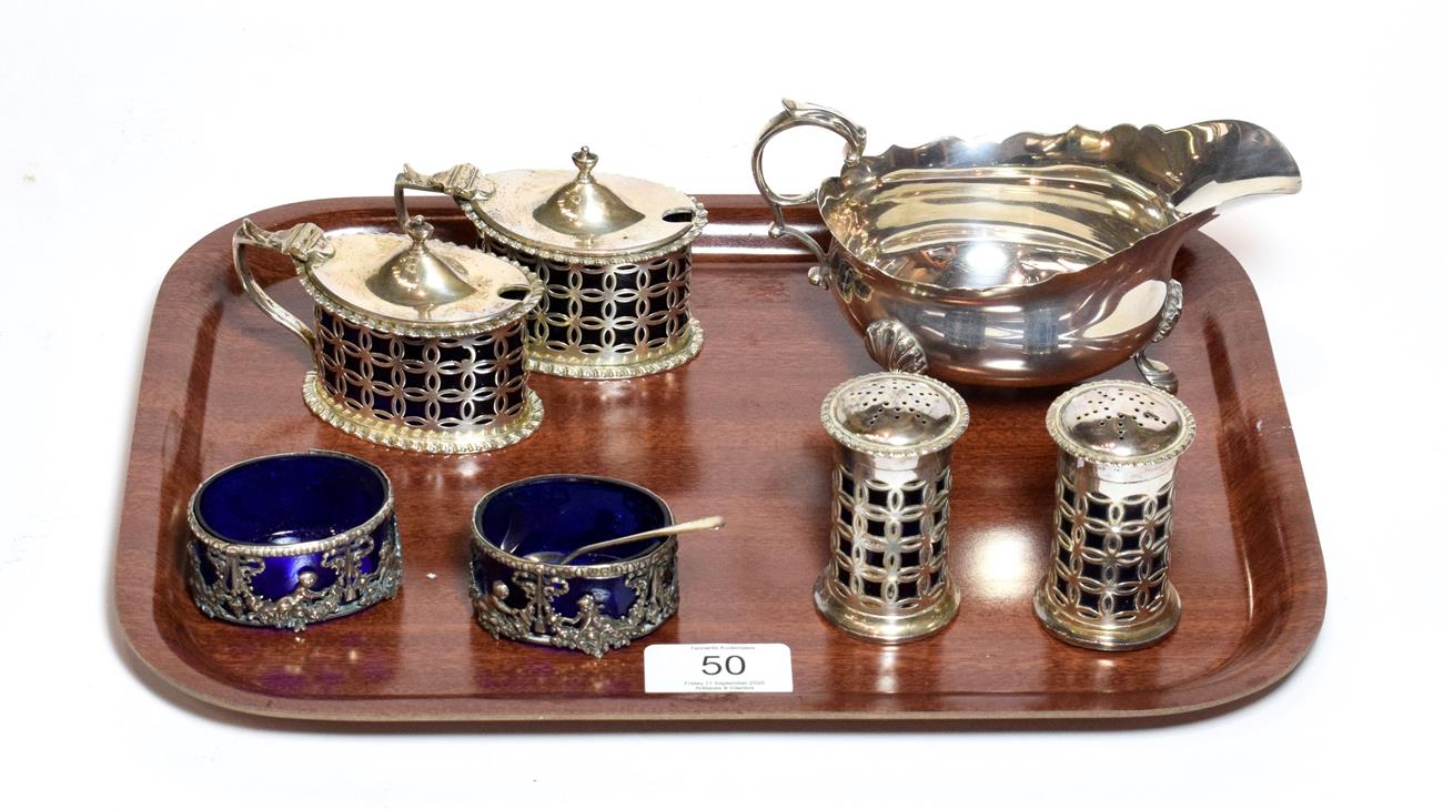 A four-piece Edward VII silver condiment-set, by Haseler and Bill, Chester, 1906, each piece with