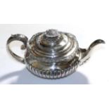 A George III silver teapot, part gadrooned decoration, London 1822, possibly Robert Peppin, 21ozt