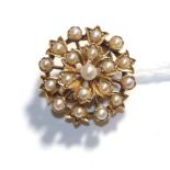 A split pearl brooch/pendant, measures 2.0cm diameter . Unmarked. Gross weight 4.21 grams.