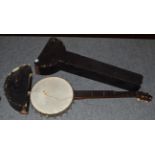 An early 20th century banjo in a fitted case