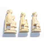 Three Chinese ivory figures seated on chairs