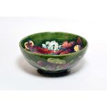 A Walter Moorcroft 'Orchid and Spring Flowers' pattern bowl