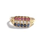 An 18 carat gold ruby, sapphire and diamond ring, finger size O1/2. Gross weight 4.5 grams.
