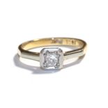 A diamond solitaire ring, stamped '18CT' and 'PLAT', finger size I. Gross weight 2.5 grams.