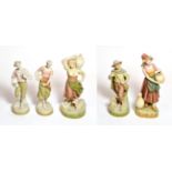 Five various post 1919 Royal Dux figures including four water carriers and a boy and dog, tallest