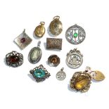 A 9 carat gold gem set pendant, three white metal brooches, a plated brooch, two plated lockets, a