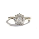 A diamond cluster ring, stamped '18CT' and 'PLAT', estimated diamond weight 0.50 carat