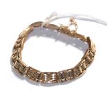 A fancy gate link bracelet, stamped '15', length 17cm . Gross weight 14.73 grams.