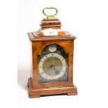 A burr walnut mantel time piece single barrel movement, stamped Buren, Swiss made