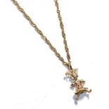 A 9 carat gold articulated doll pendant on a ropetwist chain stamped '916', pendant length 4.1cm,