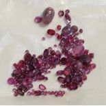 A quantity of loose rubies totalling 25.66 carat approximately and a selection of cabochon and