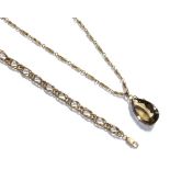 A 9 carat gold fancy link bracelet, length 20cm and a smoky quartz pendant on a 9 carat gold fancy