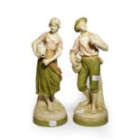 A pair of post 1919 Royal Dux figures of a man and woman drinking, model numbers: 2155 & 2156,