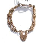 A fancy link bracelet with a heart shaped padlock clasp, stamped '9CT', length 19.5cm . Gross weight
