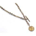A fancy link watch chain stamped '9' and '.375', hung with a loose mounted 1892 full sovereign .