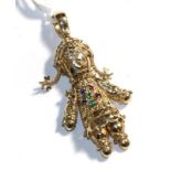 An articulated gem set doll pendant, stamped '9K', length 6.2cm . Gross weight 15.93 grams.