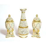 A pair of Royal China works, Worcester reticulated vases and covers, together with a similar vase,