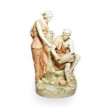 An early 20th century hard case porcelain figure of male and female potters on a naturalistic