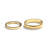 Two 18 carat gold band rings, finger sizes K and U. Gross weight 4.9 grams