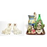 A pair of Victorian Staffordshire dogs, together with a Maiolica jug and various other pottery,