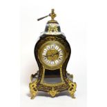 A late 19th/early 20th century French Boulle style mantle clock with key and pendulum