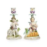 A pair of 19th century German porcelain figural candlesticks