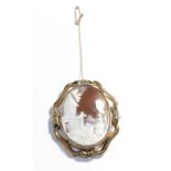 A Victorian shell cameo brooch, depicting a pastoral scene in a scroll frame, 6cm by 5cm . Unmarked.