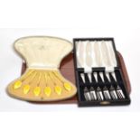 Henry James Hulbert, a cased set of silver and yellow enamel coffee spoons, with import marks