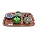 Four millefiori paperweights and another (5)