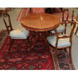 A set of three Victorian walnut salon chairs
