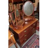 A mahogany four drawer straight fronted chest and three assorted mahogany toilet mirrors