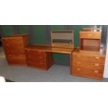 A cherry bedroom suite from Heales comprising a five-drawer chest, a three door chest a dressing