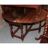 An early 18th century oak gate leg dining table