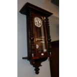 A mahogany cased wall clock with enamel dial