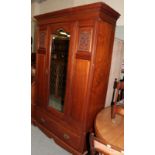 A late Victorian walnut single door wardrobe