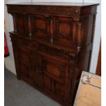 An reproduction oak court cupboard in the 17th century style