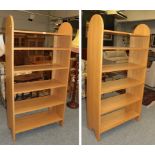 A pair of modern Shaker bookcases, circa 2000, each with two shaped uprights and six fixed