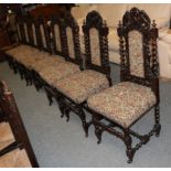 A set of ten Victorian carved oak dining chairs, circa 1880, including two carvers, recovered in