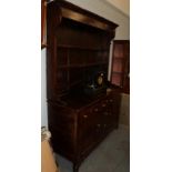 An 18th century oak and pine lined enclosed dresser and rack