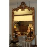 A Rococo style gilt wall mirror