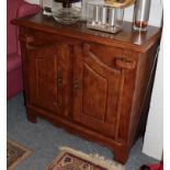 A Barker and Stonehouse oak cupboard