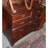 A George III oak and mahogany cross banded five-drawer chest