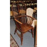 A 19th century ash spindle back armchair