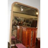 A gilt over mantel mirror