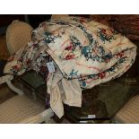 A pair of wide floral chintz curtains with pelmet and tie backs