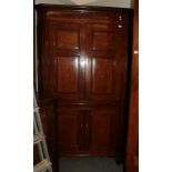 A good George III oak, mahogany and marquetry decorated free-standing corner cupboard, late 18th